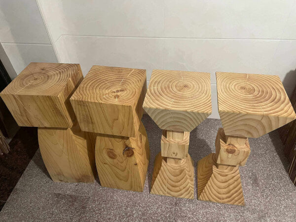 Set of 4 natural solid wood kitchen stools with unique grain patterns and rustic design.